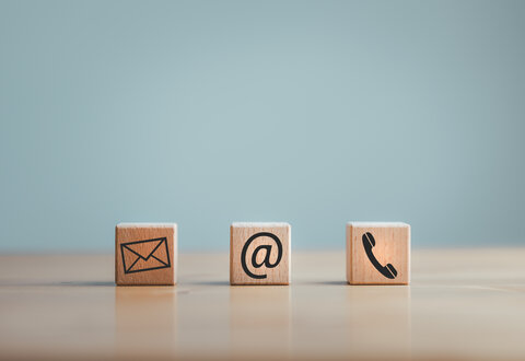 contact us icon email, address, phone, on wood cube, customer service and support for self quarantine business working at home, Telecommuting, Teleworking.